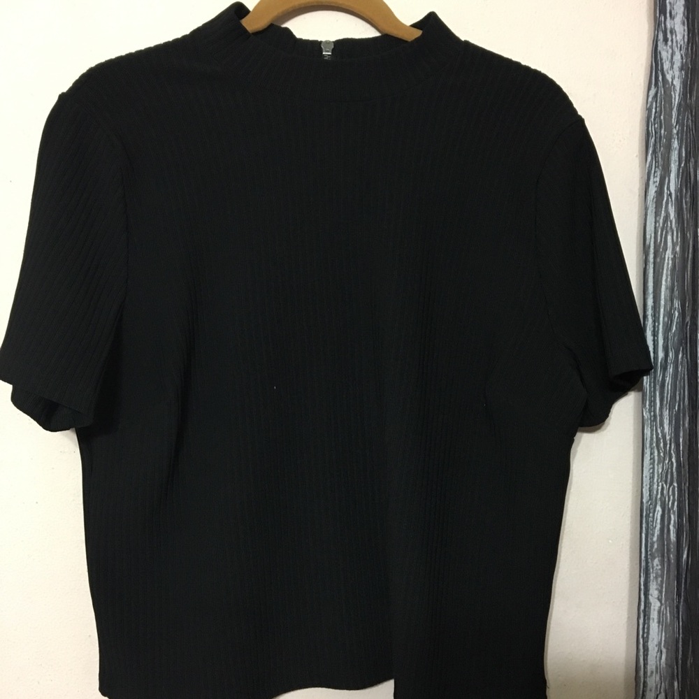 Cropped, high neck ribbed top